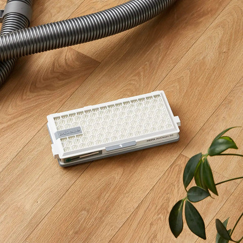 SFHA 50 Active HEPA Filter For S4 S5 S6 And S8 Vacuum Cleaners Replacement Part on wooden floor near vacuum hose