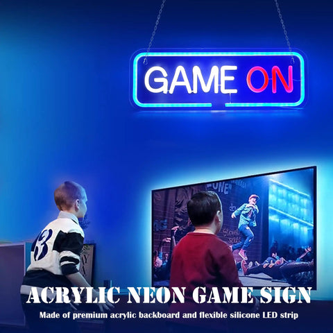 Lit Gaming Neon Sign Light For Bedroom Decor 3D Geometry LED Neon Art USB Powered With Acrylic Backboard And Flexible Silicone LED Strip Dope Wall Accent For Gamers. "Game On" text in neon light above boys playing video game.