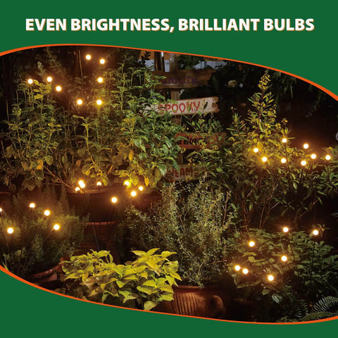 Solar Powered Firefly Lights 8 LED Outdoor Garden Lights waterproof with warm white glow illuminating backyard plants.