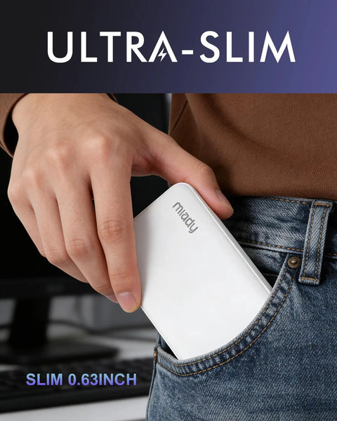 Person holding Slim Two Pack Portable Charger And 10000 Mah Power Bank For Travel sliding into a pocket, ultra-slim design 0.63 inch thick.