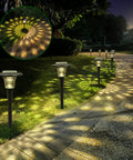 Outdoor Solar Lights for Yard and Pathway, Auto RGB Color Changing and Warm White Glass Landscape Lights illuminating a garden path