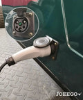 Close-up of Top Shelf Charging Power Cord Assembly For MadJax X Series Storm and Star Ev Golf Cart plugged into outlet.