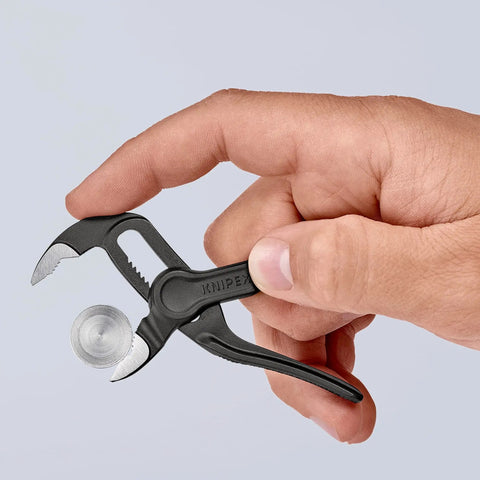 Cobra XS Mini Water Pump Pliers, 100 Mm, Self Locking, One Hand Fine Adjustment By Button Push, shown adjusting a nut.