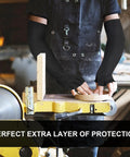 Person wearing Arm Sleeves With Thumb Hole For Men And Women Cut Resistant Protective Sleeve All Day Comfy working with wood.