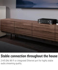 AirPlay Audio Streaming Interface For Your HiFi Setup With Latency Compensation And A Solid DAC on wood cabinet