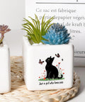 Square ceramic planter with a black cat design featuring succulents, text saying 'Just a girl who loves cats' on white background.