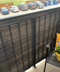 Balcony Privacy Screen Cover 3.5 Feet by 16.5 Feet Black UV Resistant Fence Screen on apartment balcony railing.