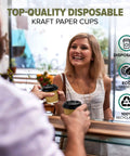 Barista handing over Premium 4 Oz Insulated Triple Wall Ripple Paper Coffee Cups With Black Lids 50 Pack to a smiling customer