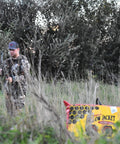 Yellow Jacket Supreme 3 Archery Target Bag Dual Sided 23 By 12 Inches in a field with an archer ready to shoot.