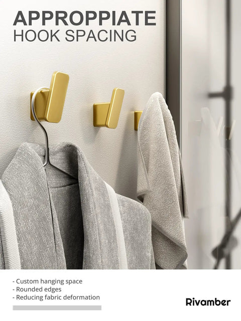 Four Pack Brushed Gold Towel Hooks For Bathroom And Mudroom Heavy Duty Wall Hangers in use with towels hanging, rustproof aluminum.