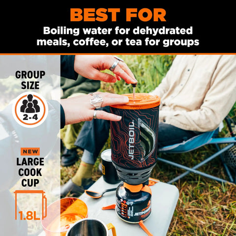Hands operating Flash Java 1.8L Portable Stove With Coffee Press For Camping And Backpacking, outdoor setting, orange topo design.