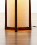 48 Inch Paper Lantern Floor Lamp With Wood Frame Asian Inspired Tower Shade For Living Room Bedroom And Office Cozy Home Vibe Lighting That Elevates Any Space showcasing lower wood frame and illuminated shade.