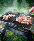 Heavy Duty Nonstick Grill Pan Set For Outdoor Barbecue Cooking Includes Two Durable Carbon Steel Trays with grilled chicken and beef.
