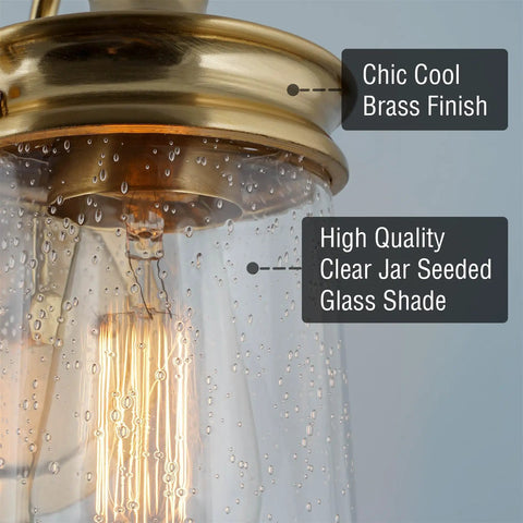 Close-up of Industrial 3 Light Vanity Light with seeded glass shade and oil rubbed bronze finish, 23 inch lantern style fixture.