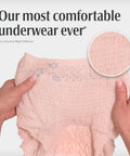 Hands holding Night Defense Adult Incontinence Underwear For Women, Overnight Maximum Absorbency Disposable Diapers, Medium, Blush