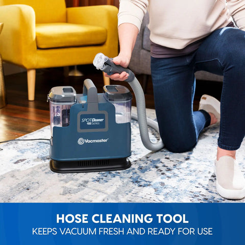 Person using Portable Carpet and Upholstery Spot Cleaner with SixFoot Hose, lightweight design for easy lifts and quick cleanup.
