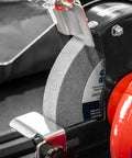 Close-up of Workhorse 150Mm Bench Grinder equipped with a coarse 150mm grinding wheel and spark shield, designed for tough tasks.