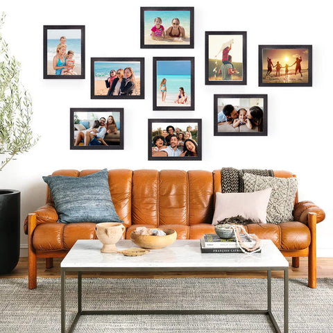 Living room with framed photos above a leather sofa; 8x10 Sublimation Blanks Set, 15 Double Sided Canvas Pads display.