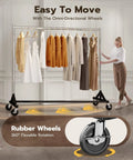 Side view of a Heavy Duty Rolling Garment Rack With 500LBS Capacity Adjustable Chrome Clothes Rack On Wheels in use
