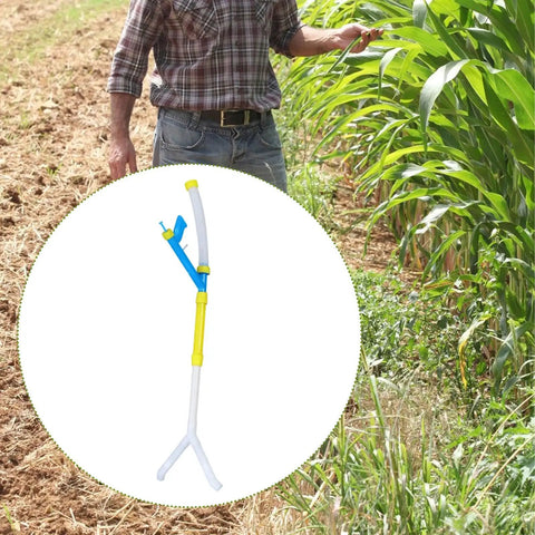 Handy Manual Fertilizer Spreader For Farm Use Time Saving Press Type Tool 90 cm PVC device on field near tall corn plants
