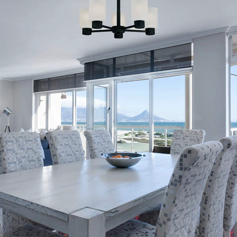 Dining room with Five Light Oil Rubbed Bronze Dining Room Chandelier Hanging Fixture, sloped ceiling compatible, ocean view.