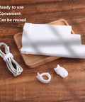 60 Pack Hook And Loop Cable Ties 6 7 8 Inch White for cable organization on a wooden surface with wrapped cable in focus