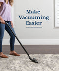 Person vacuuming on Rug Gripper Pad For Hardwood Or Tile Floors 2x3 Ft Thick Non Slip Under Rug Mat Keeps Rugs From Bunching And Sliding