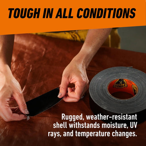 Person using Heavy Duty Black Duct Tape 1.88 Inch By 50 Yard Indoor Outdoor Weather Resistant With Reinforced Backing And Double Thick Adhesive