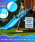 Child sliding on Backyard Cedar Outdoor Swing Playset With Two Belt Swings, Fort With Sloped Roof, Sandbox, Ladder, 6 Foot Slide, And Ground Anchor Kit For Backyard Fun Up To Seven Kids showing durable blue slide.