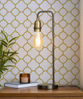 Lamp on table in front of white and gold peel and stick wallpaper self adhesive removable trellis pattern for walls and furniture modern gold grid vinyl roll for bedroom kitchen renovation and DIY decor.