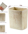 Natural Travertine Textures Tiny Trash Can 1.8 Gallon Bathroom Space Saver Garbage Bin with dimensions and hand for scale.