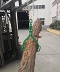 Log Lifting Tongs With Two Serrated Swivel Claws 32 Inch Opening lifting log with a forklift in industrial yard.
