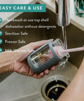 Hand washing Ultra Wide Neck Glass Breast Milk Storage Bottle with BPA free silicone cap in sink.
