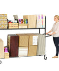 No Bull Heavy Duty Packing Station Cart With Fully Adjustable Height Steel Wire Shelving Plus Smooth Rolling Locking Casters, loaded with supplies.