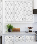 Silver Gray Peel And Stick Wallpaper For Cabinets And Bathrooms No Mess DIY Ready Modern Boho Leaf Design shown on kitchen cabinets