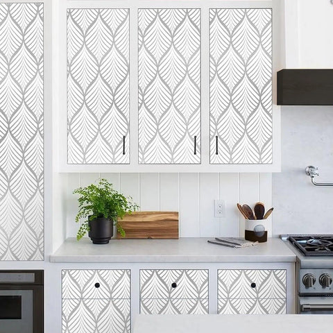 Silver Gray Peel And Stick Wallpaper For Cabinets And Bathrooms No Mess DIY Ready Modern Boho Leaf Design shown on kitchen cabinets