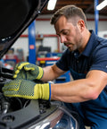 Mechanic wearing Yellow Medium Kevlar Knit Cut Resistant Work Gloves For Tough Jobs ANSI Rated Hand Protection From Glass Sheet Metal And Sharp Objects