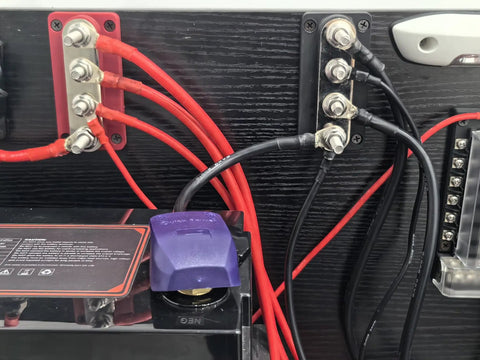 Heavy Duty 600 Amp Copper Bus Bar Power Distribution Block Featuring Nickel Plated 3/8 Terminals connected to audio wiring.