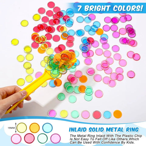 Hand holding yellow wand with colorful chips from 24 Pack Magnetic Bingo Wands With 700 Metal Translucent Chips For Fun STEM Learning And Family Game Night.