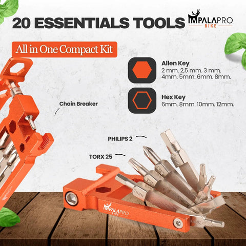 Lightweight 20 In 1 Bike Multitool Kit In Orange With Chrome Vanadium Construction A Trail Ready MTB Repair Tool Featuring Chain Breaker Allen Keys Torx Screwdrivers Spoke Wrenches And More For Quick Fixes On The Go, showing tools spread out on a wooden surface.