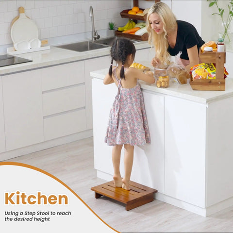 Child standing on 3.5 Inch Wooden Step Stool For Adults, Fully Assembled And Ready To Roll, Acacia Wood Construction, reaching counter in kitchen