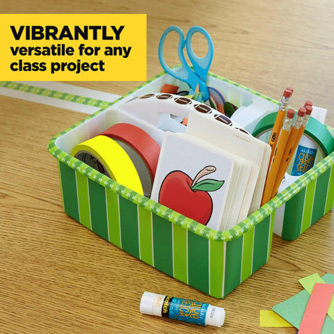 Classroom supplies featuring colored masking tape set, scissors, pencils, and cards in a green striped box on a table.