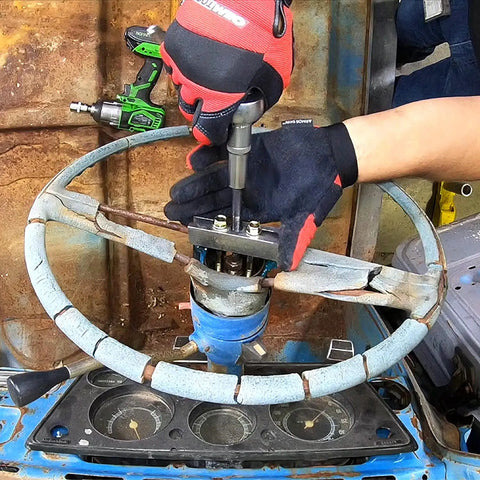 Mechanic using Steering Wheel Puller Set For All Major Cars And Trucks With Lock Plate Remover Includes 5/16 adapters