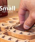 Emery cloth roll sandpaper; brown abrasive strip used for hand sanding wooden shapes.