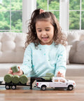 Child playing with Ford Pickup With Gooseneck Trailer Bale Holder And Bales Farm Toy Set For Kids Realistic Farm Hauling Vehicle White And Green Durable Play Truck For Imaginative Builders