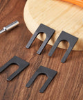 Heavy Duty Four Pack Drill Chuck Removal Wedge Set Compatible With Jt33 And Jt6 Arbors, No Sweat Keyless Chuck Extractor Tool Opens, 4 black steel wedges on wood.
