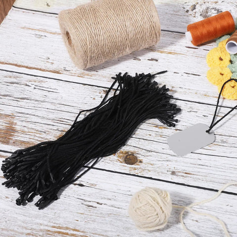 Hella Sturdy Black Cotton Hang Tag Strings With Quick Click Snap Lock Pins 200 Pack for easy attachment on merchandise.