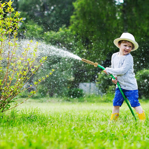 Child watering garden with Solid Brass Hose Nozzle Set, 2 Pack Heavy Duty Garden Nozzles With 10 Rubber Washers, 3/4 Inch Universal Fit For Standard Hoses, Adjustable Spray, Built Tough A Real Workhorse For Easy Watering And Quick Yard Cleanup.