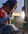 Welder using E6013 Welding Rod For Carbon Steel Three Thirty Second Inch Diameter Two Pound Electrodes with sparks flying