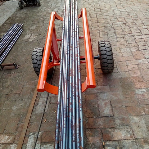 Beefed Up Heavy Duty Double Utility Pole Dolly With Two Wheel Concrete Pole Transport Cart For Electrical Crews Built Tough With Solid Steel Frame Easy Maneuver On Rough Job Sites And Heavy Poles, steel frame with two wheels carrying concrete poles